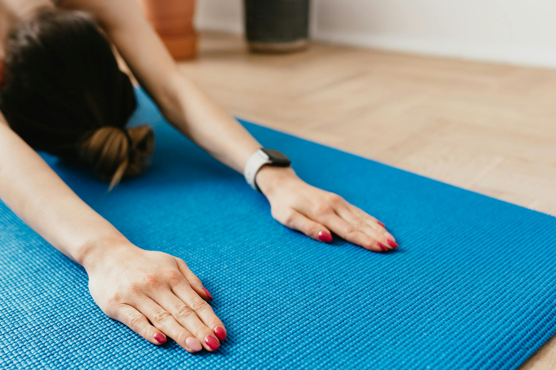 Person doing a mindful stretching or mobility routine indoors