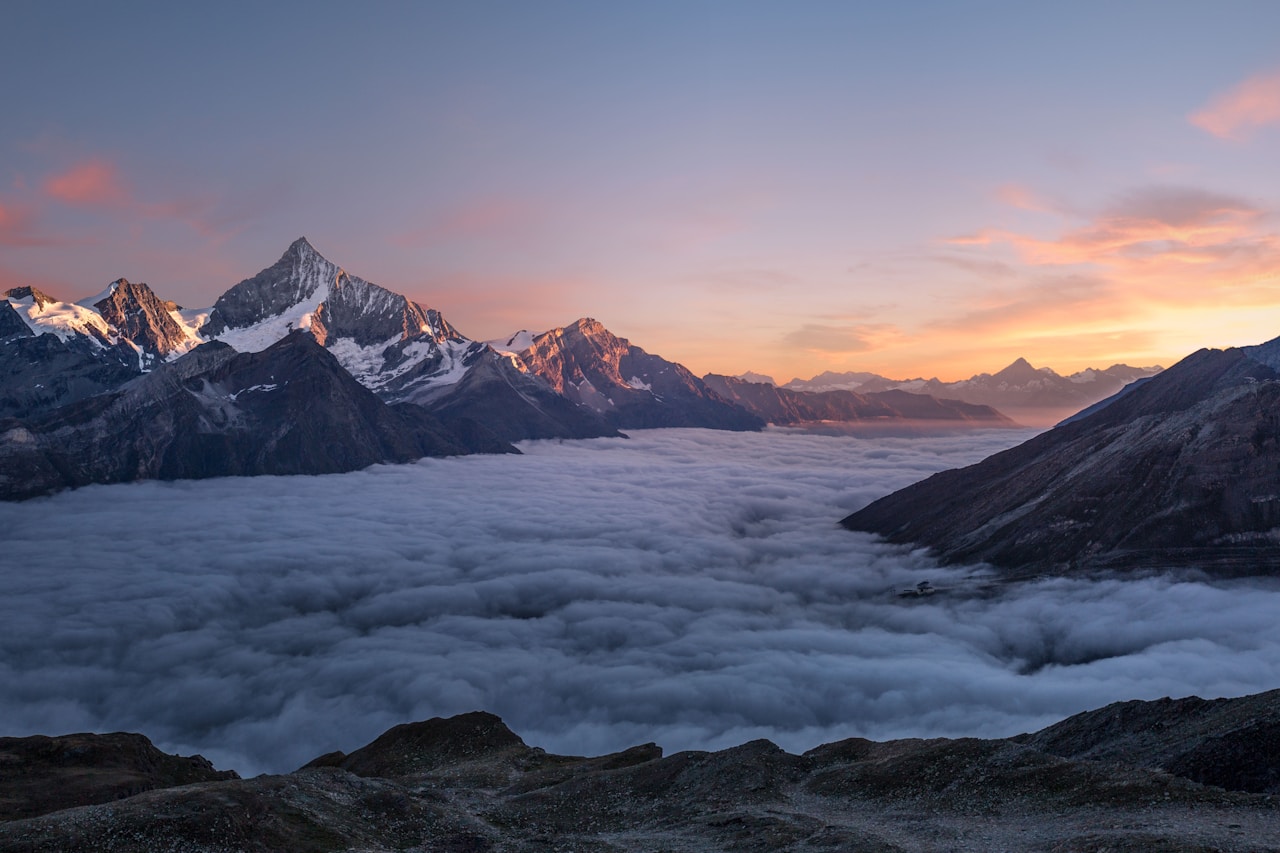Snow-covered mountain peaks under a clear blue sky