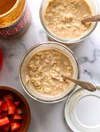 Tray with jars, spoons, and oat toppings ready for prep